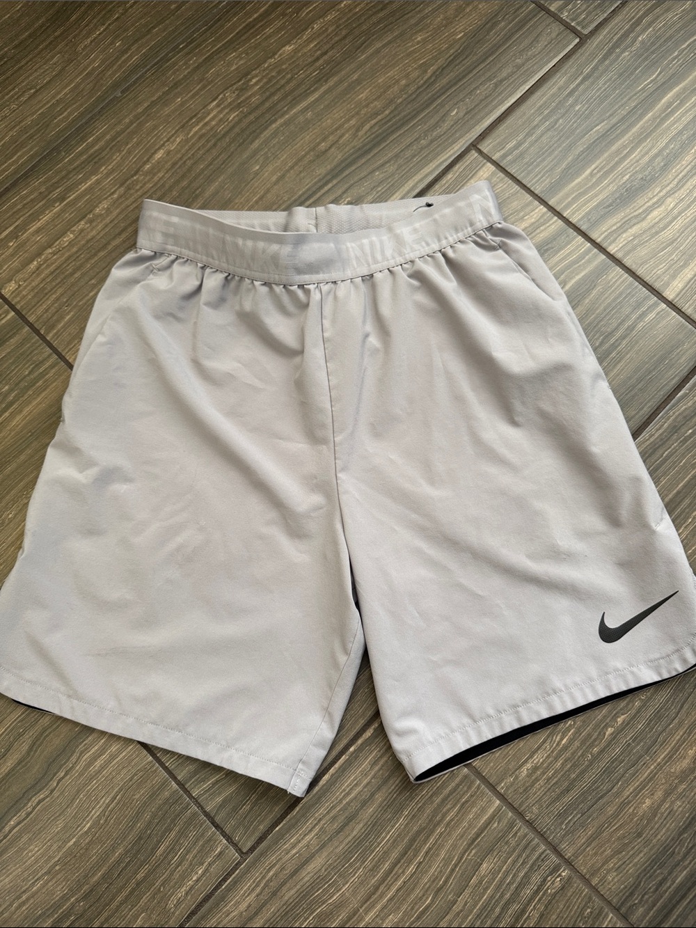 Nike Men’s Light Gray Athletic Shorts with Black Swoosh